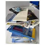 New and used office supplies, assorted in bin.