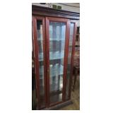 Lighted curio cabinet with glass shelfs woth