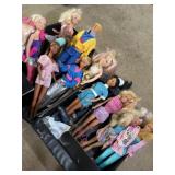 10 Barbie dolls in fashion doll case