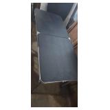 Small folding table with adjustable legs 46x19in