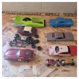 2 1/32 scale slot cars, 2 extra plastic bodies,