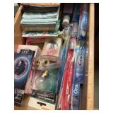 Contents of drawer, including toothbrushes, new