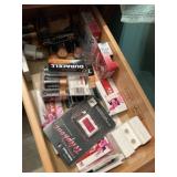 Contents of drawer, including batteries, glade