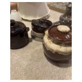 brown drip-glaze ceramic bean pot, and two
