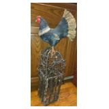 Raw twig bird house with decorative bird
