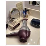 Bathroom items, including Revlon, blow dryer, con