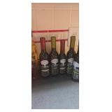 Collection of gourmet artisan glass bottles from