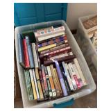 Variety of books in tote with lid