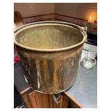 brass bucket featuring a sturdy iron handle 15