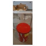Box fan and Coca-Cola tin