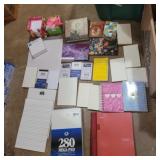 Assorted notepads and notebooks
