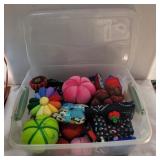 Assorted pin cushions on container with lid