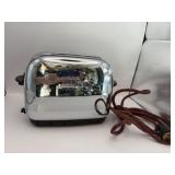Vintage chrome two slicer toaster has a little