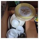 Golden wheat plates, white glass cups and other