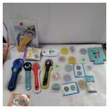 Rotary cutters, blades, and sharpener in box with