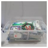 Appliques and stickers in container with lid