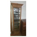 Lighted curio cabinet,  mirrored back with glass