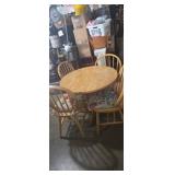 Round wooden dinning table with 4 matching chairs