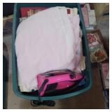 Assorted fabric and iron in tote with lid