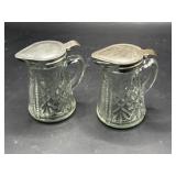 Pair of pressed glass syrup pitchers