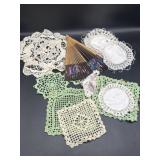 Handheld folding fan and variety of knit doilies