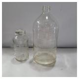 2 glass bottles 5in and 9in