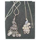 2 silvertone peacock charm necklaces