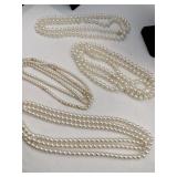 Multi-strand white beaded necklaces