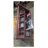 Wooden tool box with saw blades and nails