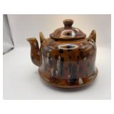 Ceramic brown spotted teapot, no handle.