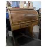 vintage wooden rolltop desk with a tambour
