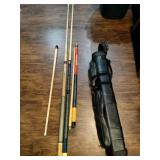 Three pool sticks in case with accessories