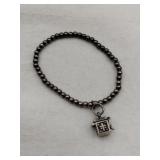 Silver beaded bracelet w/ charm marked 925 .185oz