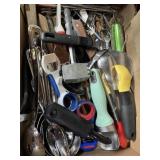 Assorted kitchen tools, scoops, bottle openers,
