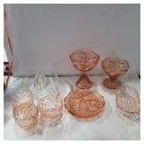 Pink depression glass and clear glass juicer
