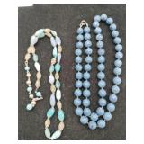 2 blue beaded necklaces