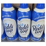 4 cans of extra creamy reddi wip (in kitchen)