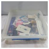 Jewelry making items in container with lid