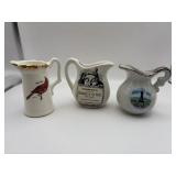 Three small souvenirs creamers 3 1/2 to 4 inches