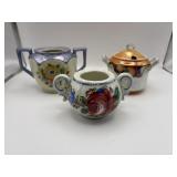 Three vintage sugar bowls, one with lid.
