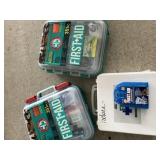 Three first aid kits packed full of supplies