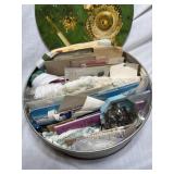 Tin full of vintage sewing item buttons zippers