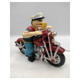 Modern cast iron Popeye on motorcycle