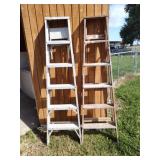 Two 6 foot laddets. One wood, one aluminum.