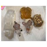 Various clear and amber glass figures, metal frog