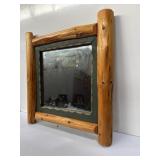 rustic wall mirror with a natural log wood frame