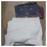 Large white blanket and woven throw blanket