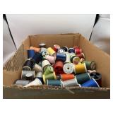 Box full of thread, some open some new all sizes.