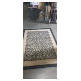 Cheetah print area rug 88x63in