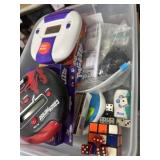 Handheld and electronic games in lidded container
